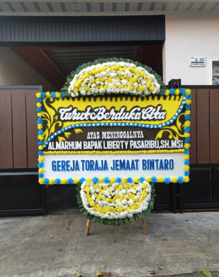 Papan Bunga Duka di Flamboyan Baru